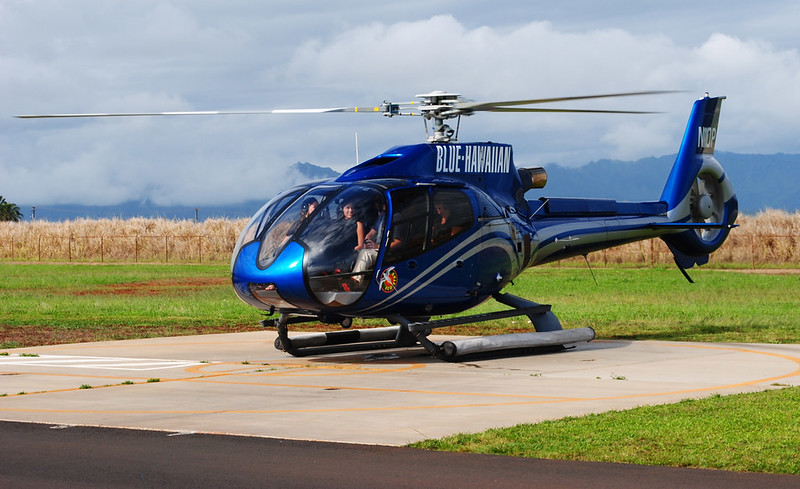 A helicopter idling on a landing pad