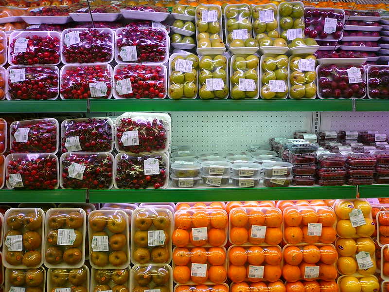 Produce in containers on a grocery store