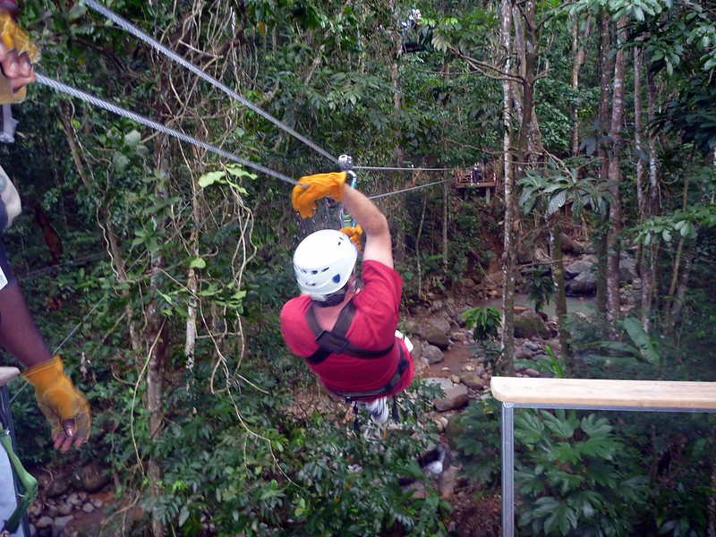 A man going down a zipline